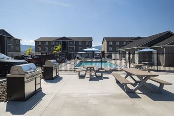 Take a dip in the pool at the whispering winds apartments in pearland, tx
